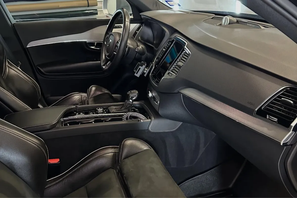Clean black car interior with leather seats and modern dashboard