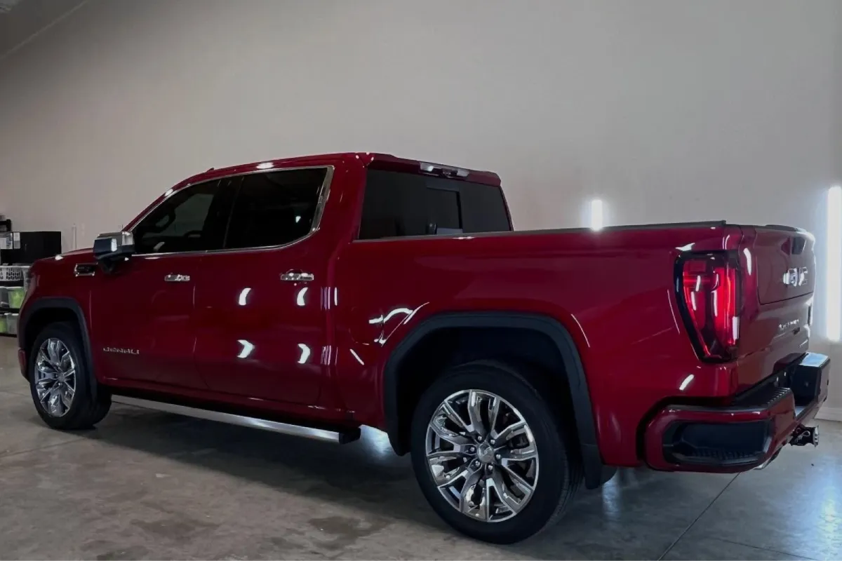 Professional paint correction restoring shine to a GMC Sierra.