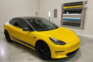 Yellow Tesla Model Y featuring a custom vinyl wrap.